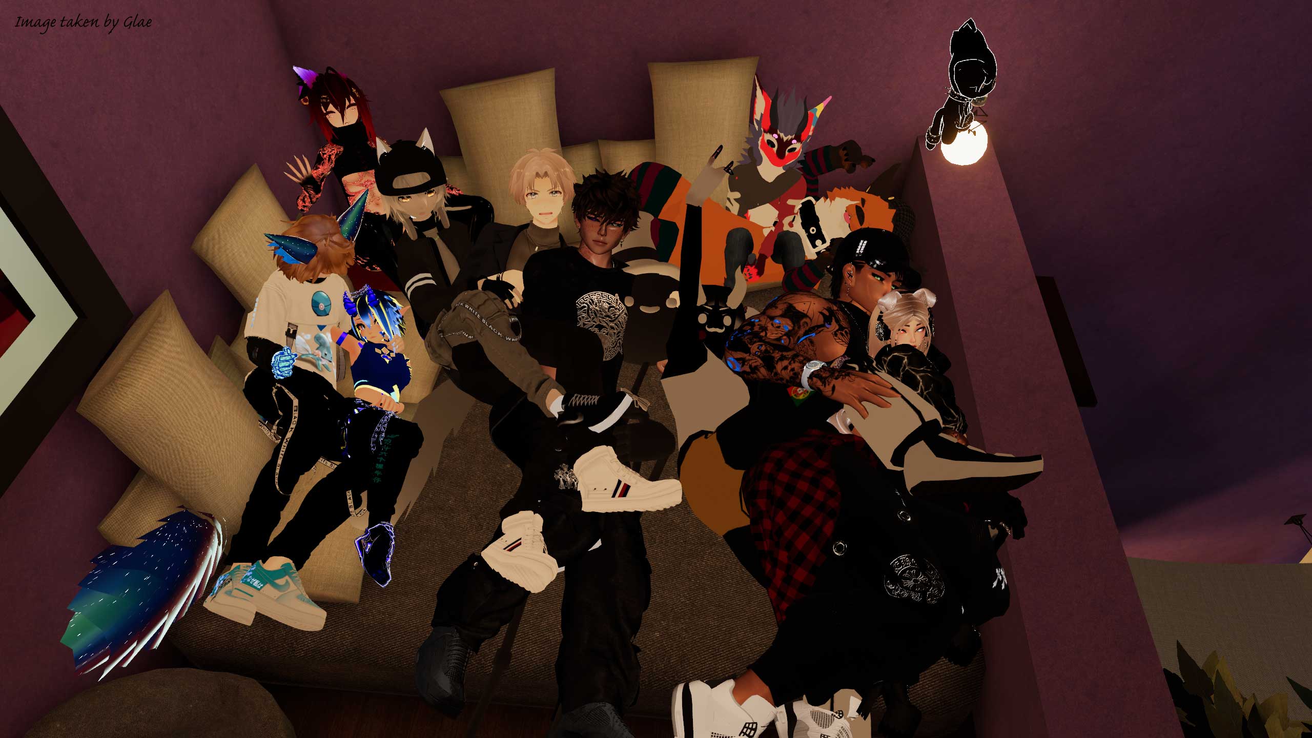 A bunch of avatars laying down in a comfy area for a photo